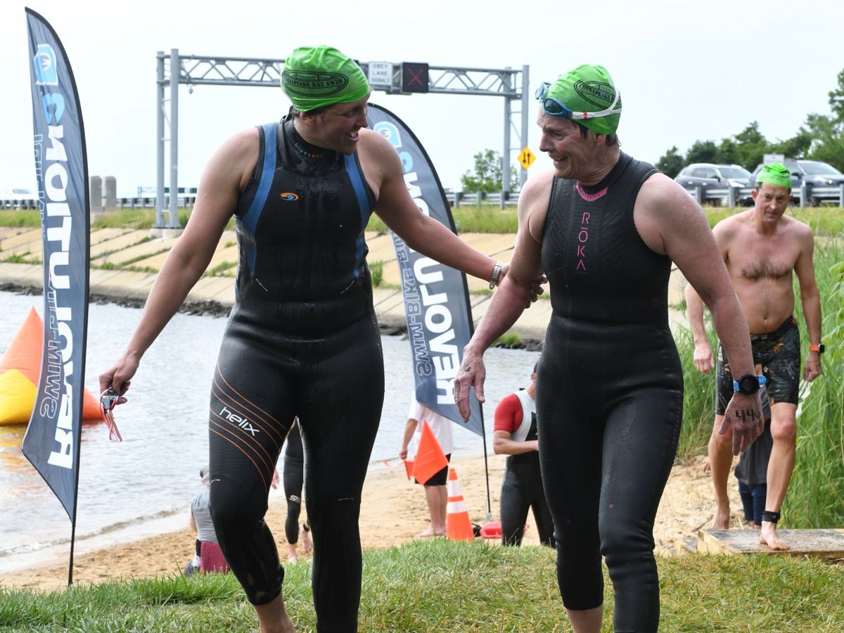 Coach Kim and Coach Julie finish the 2025 4.4 mile Chesapeake Bay swim on a stormy day!